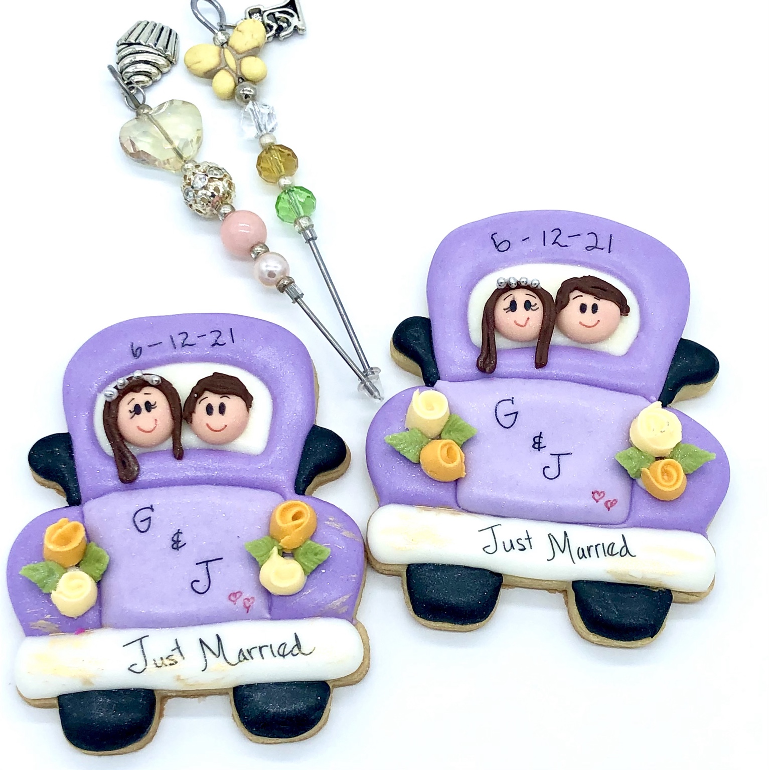 Purple just-married car cookies with floral details