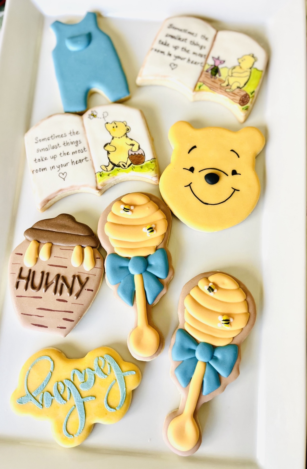 Winnie-the-Pooh-inspired baby shower cookies on a platter